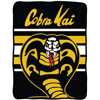 Striking Cobra Emblem Stripes Blanket: Bold Dojo Art for Fans