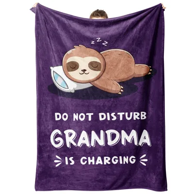 Sleepy Sloth Grandma Charging on Purple Blanket