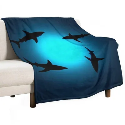 Sharks Under Glowing Ocean Blanket: Deep Blue Silhouette Design