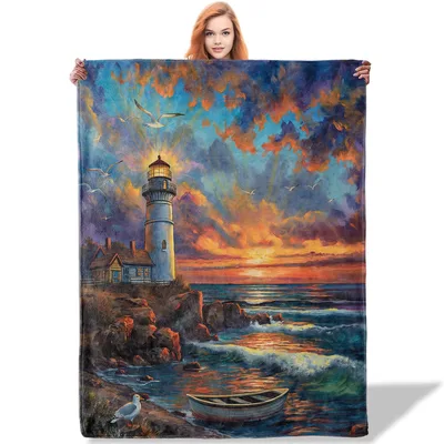 Lighthouse Sunset Seascape Blanket featuring a glowing coastal tower