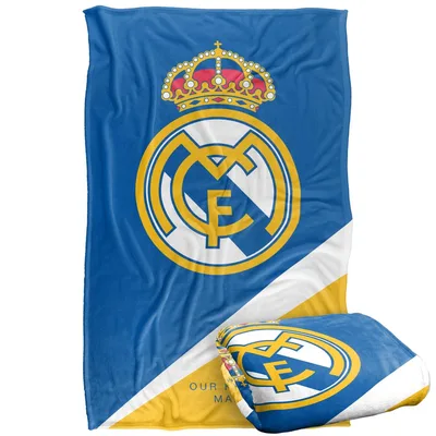 Crest Emblem on Blue Blanket: Real Madrid Crest Design with Crown
