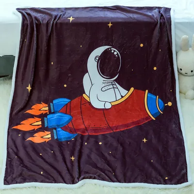 Astronaut Riding Rocket Blanket featuring a cartoon spaceman
