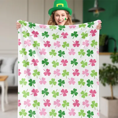 Pink and Green Shamrock Blanket featuring a repeating clover pattern