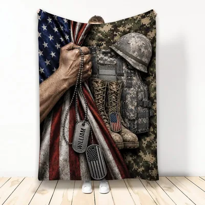 Soldier Holding American Flag Blanket with Dog Tags and Camo Gear