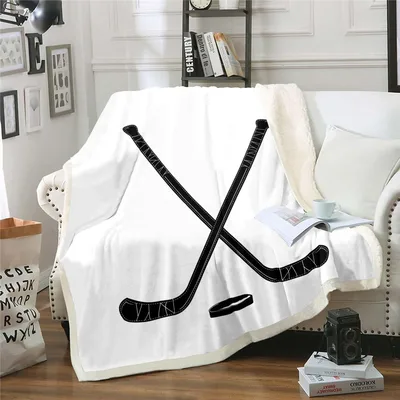 Crossed Hockey Sticks with Puck Blanket: Iconic Sports Design
